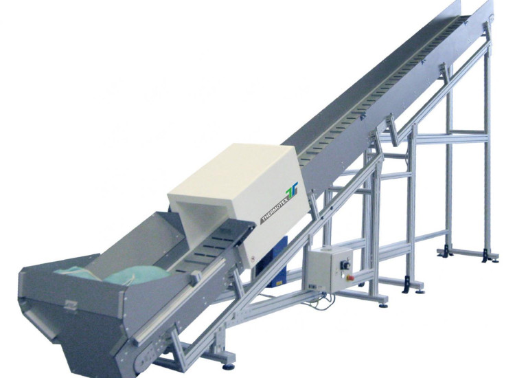 Convoyeur ascentionnel pour le tri du linge sale » THERMOTEX NAGEL GmbH
